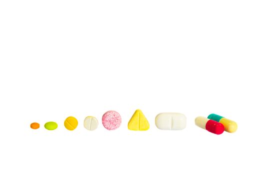 various shape of drugs on white background (isolated) and blank area at upper side