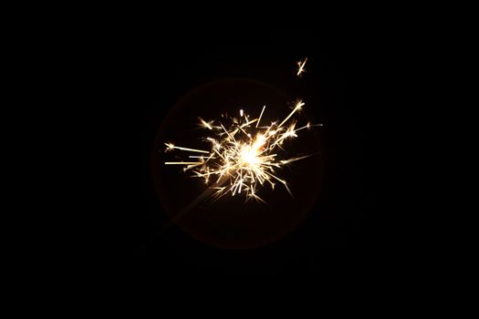 burning sparkler on a dark background