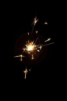 burning sparkler on a dark background