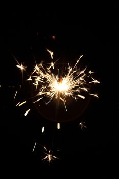 burning sparkler on a dark background