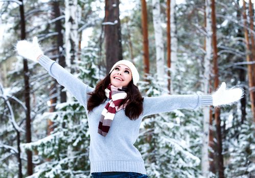 Happy woman in a winter forest