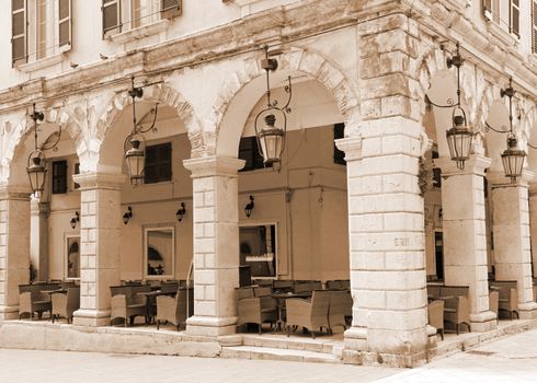 Greece. Corfu (Kerkyra) island. Corfu town. An open-air cafe. In sepia toned 