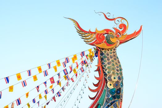 Tip of boat was decorated to swan shape and Flags in evening at Golden Triangle ,Chiangrai ,Thailand