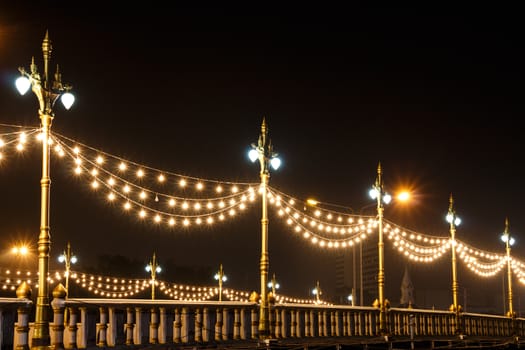 Naresuan bridge and streetlamp at night in Phisanulok ,Thailand