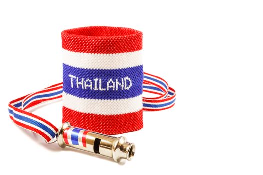 Whistle and wristband in thai flag pattern (symbol of resistance to thai government) on white background (isolated) and blank area at right side