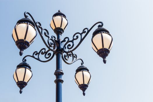 the street lamp and blue sky with blank area at right side