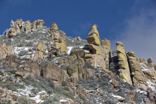 Hoodoo rock formations on Mt. Lemmon Scenic Byway are touched with snow. Location is Tucson, Arizona, USA.  