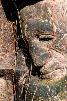 detail of a mourning sculpture on a cemetery