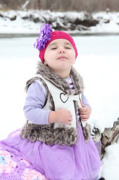 Little girl taking in the snow