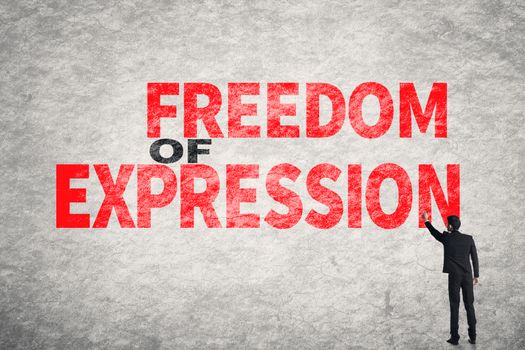 Asian businessman write text on wall, Freedom of Expression