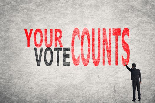 Asian businessman write text on wall, Your Vote Counts