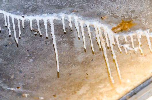 Stalactites formation on a concrete ceiling of a house due to poor sealing.