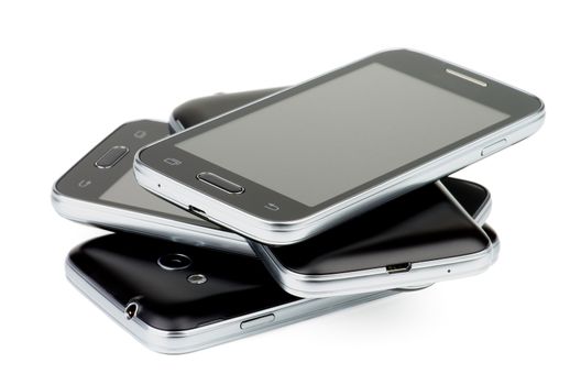 Pile of Four Black Smartphones with Silver Details and Buttons isolated on white background