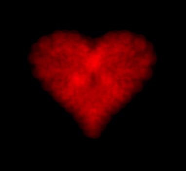 Heart shape of bokeh lights over black background
