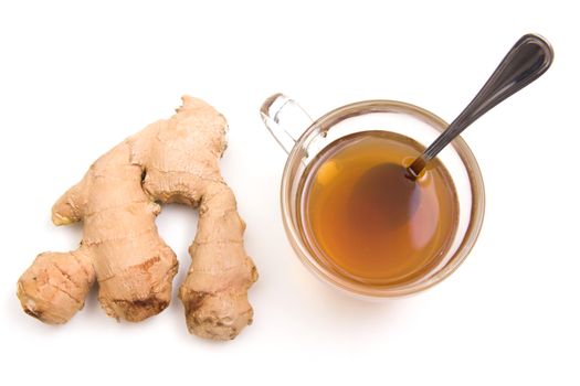 Tea with ginger on a white background seen from above