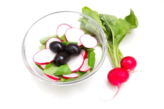 Salad radishes in bowl on white background
