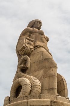 Statue of a woman with a sword and shield on one side and a serpent on the other, erected to commemorate those the Portuguese who died during the first world war in Maputo, Mozambique