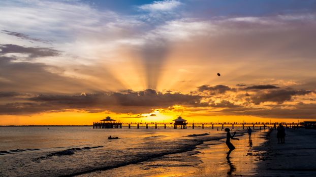 The beautiful sun setting on the shores of Fort Myers Beach located on Estero Island in Florida, United States of America