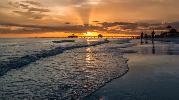 The beautiful sun setting on the shores of Fort Myers Beach located on Estero Island in Florida, United States of America