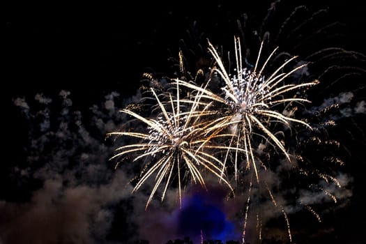 A close-up shot of sparkling Fireworks bursting out into beautiful shapes