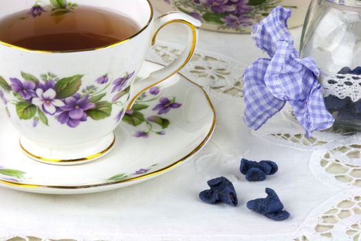 English afternoon tea with sweet and candied violets