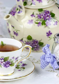 English afternoon tea with sweet and candied violets