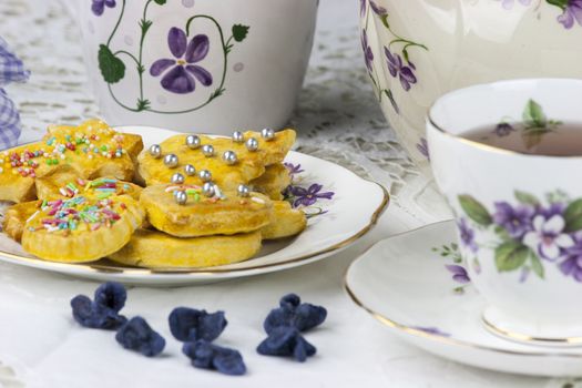 English afternoon tea with cookies and candied violets