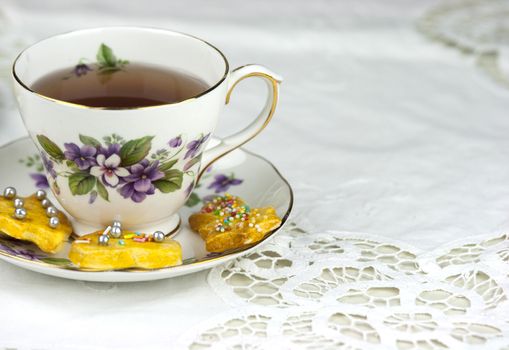 English afternoon tea with sweet and decored cookies 