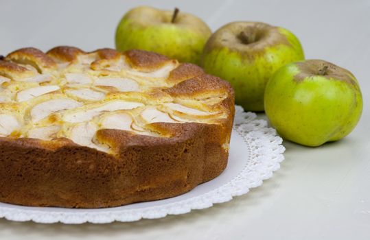 Homemade italian baked apple pie over a white table