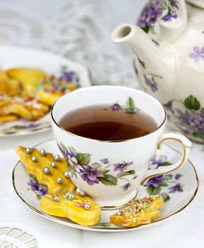 English afternoon tea with sweet and decored cookies