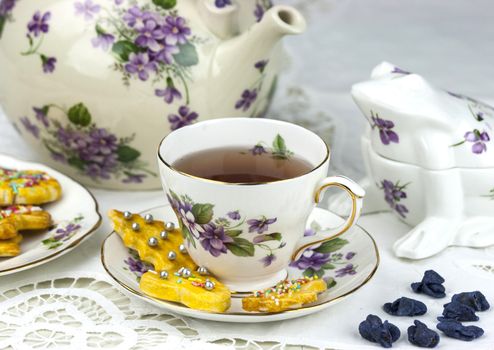 English afternoon tea with cookies and candied violets