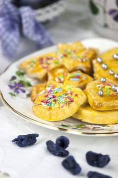 English afternoon tea with cookies and candied violets