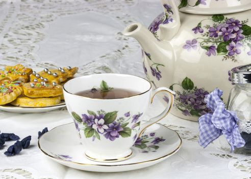 English afternoon tea with cookies and candied violets