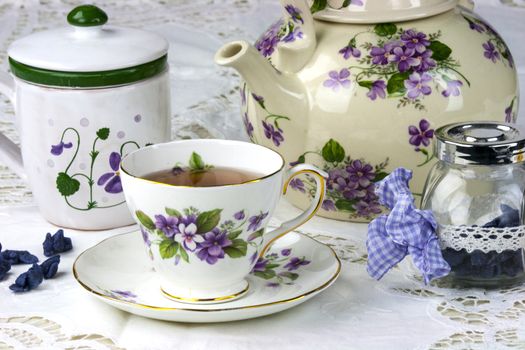 English afternoon tea with sweet and candied violets