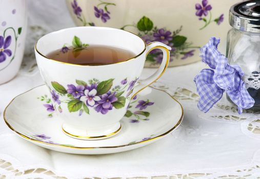 English afternoon tea with sweet and candied violets