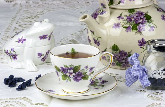 English afternoon tea with sweet and candied violets