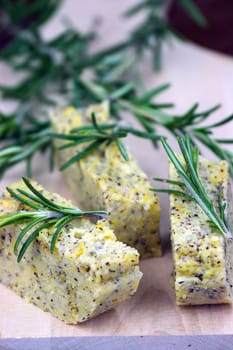 Baked polenta "taragna" (corn and buckwheat flours) with italian cheese (taleggio, gorgonzola, parmigiano reggiano) and rosemary