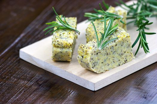 Baked polenta "taragna" (corn and buckwheat flours) with italian cheese (taleggio, gorgonzola, parmigiano reggiano) and rosemary