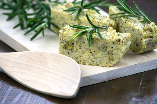 Baked polenta "taragna" (corn and buckwheat flours) with italian cheese (taleggio, gorgonzola, parmigiano reggiano) and rosemary