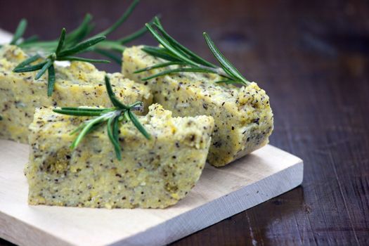 Baked polenta "taragna" (corn and buckwheat flours) with italian cheese (taleggio, gorgonzola, parmigiano reggiano) and rosemary