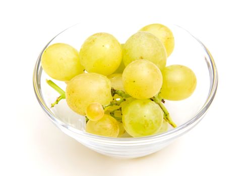 Grapes on a bowl close up view on white background