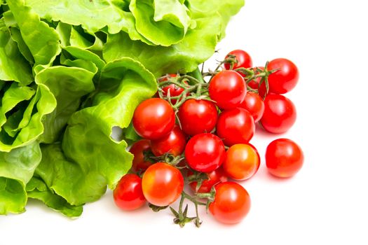 Cherry tomatoes and lettuce on white background