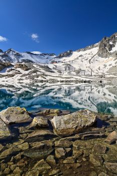 Lago del Monticello with Presena glacier on background, Tonale pass, Italy