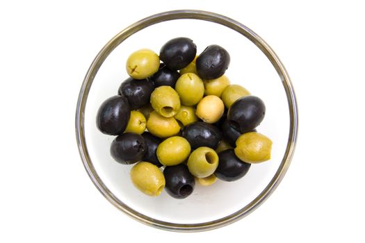 Green and black olives on white background from above