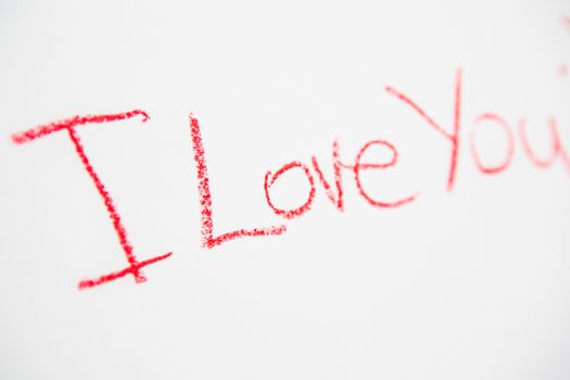 Handwritten simple words. I love You. On white paper. Creative card