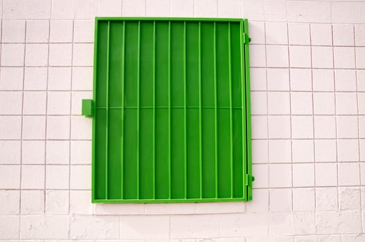 Urban design green shutter on white wall