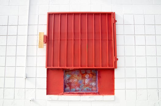 Urban design red shutter on white wall