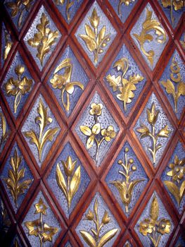 Close up of carved golden flowers on church door