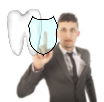 Young man with tooth shield symbol isolated on white background