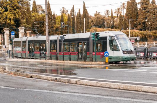 ROME - MAY 14, 2014: ATAC train speeds up in city cente. ATAC is the municipally-owned public transport company which operates most public transport lines in the city.